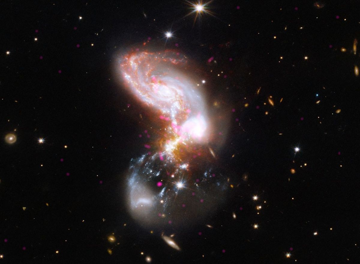 Composite view of merging II Zw 096 galaxies in magenta X-rays, blue and white optical light, and infrared detail