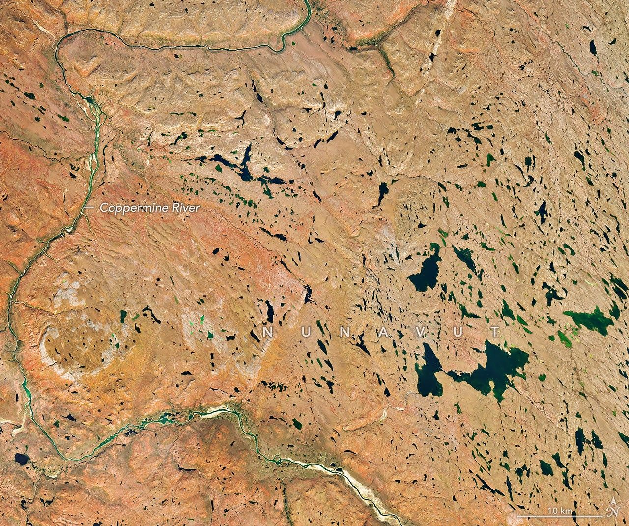 Landsat view of red and orange autumn tundra around the winding Coppermine River in Nunavut on September 6, 2026